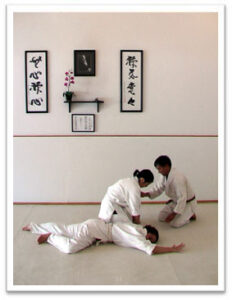 Photo of Senpai Gary Okuma with children -- at Mumonkan-Do Aikido -- Founded by Sensei Lori Parker