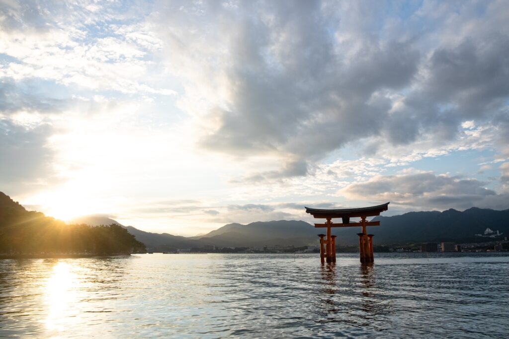 Image of Tori gate in ocean. A symbol of transition from the mundane to the sacred.