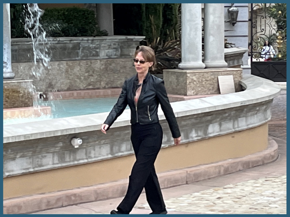 Image of Lori Parker walking by a fountain in order to show how Feldenkrais Movement Lessons can keep you active as you age.