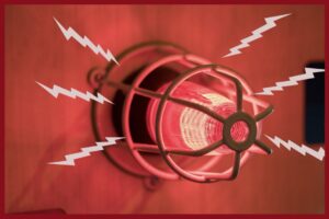 A red light on a wall, representing an active emergency alarm
