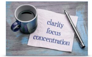 A note paper that reads "clarity / focus / concentration"