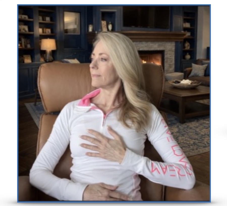 A woman placing a hand on heart and a hand on her abdomen