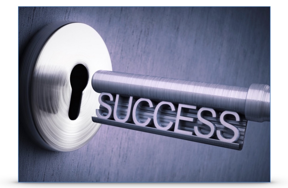 A key (which says "Success") going into a lock