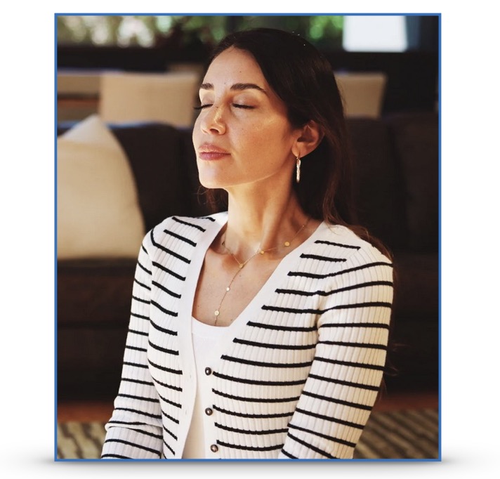 A woman breathing deeply